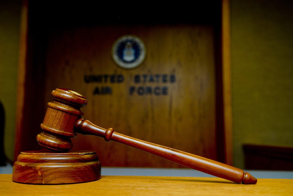 Courts Are Grappling With AI-Generated Evidence A judge's gavel resting in a courtroom, symbolising the legal process.